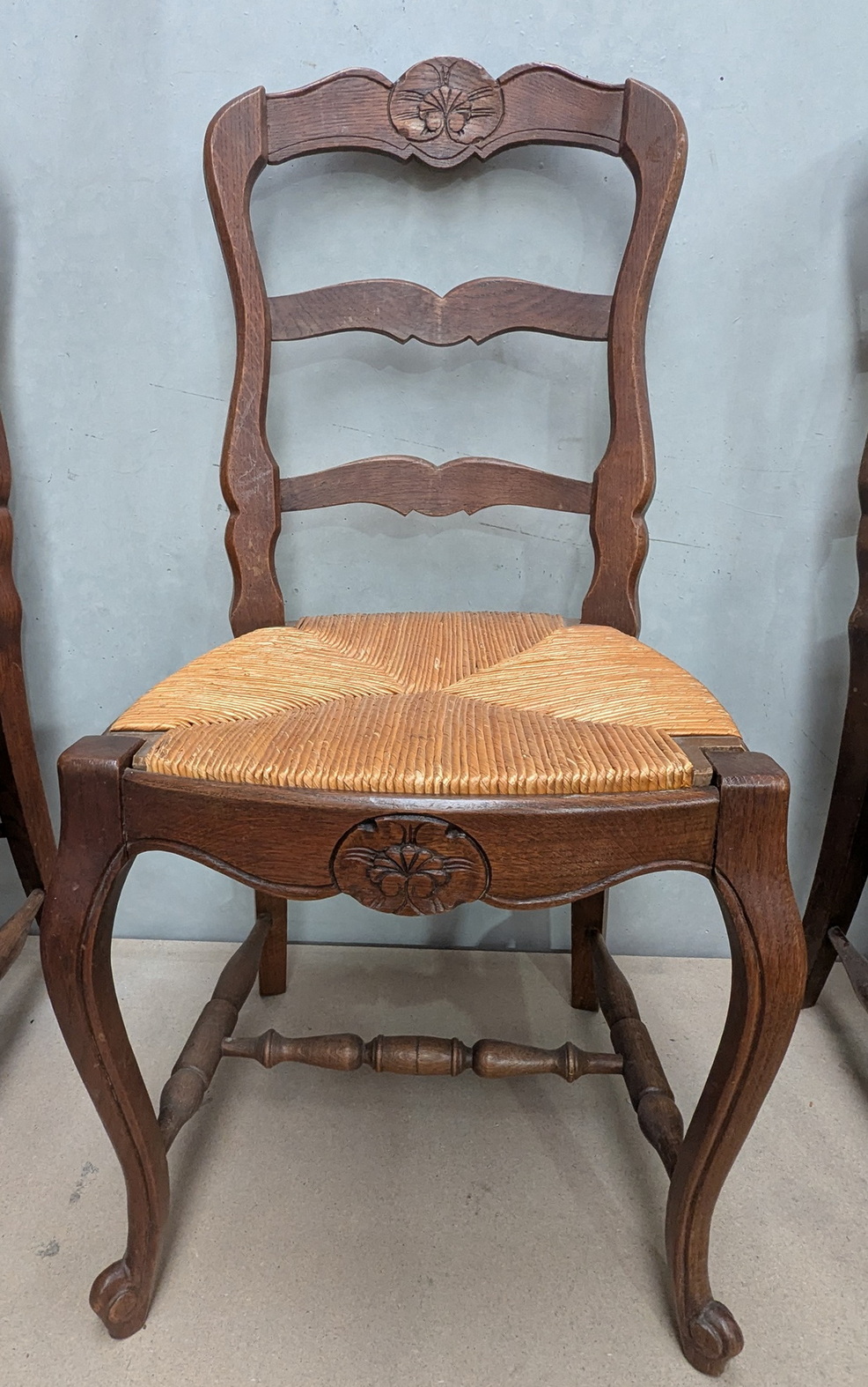 A set of 4 French Provincial Ladderback Chairs